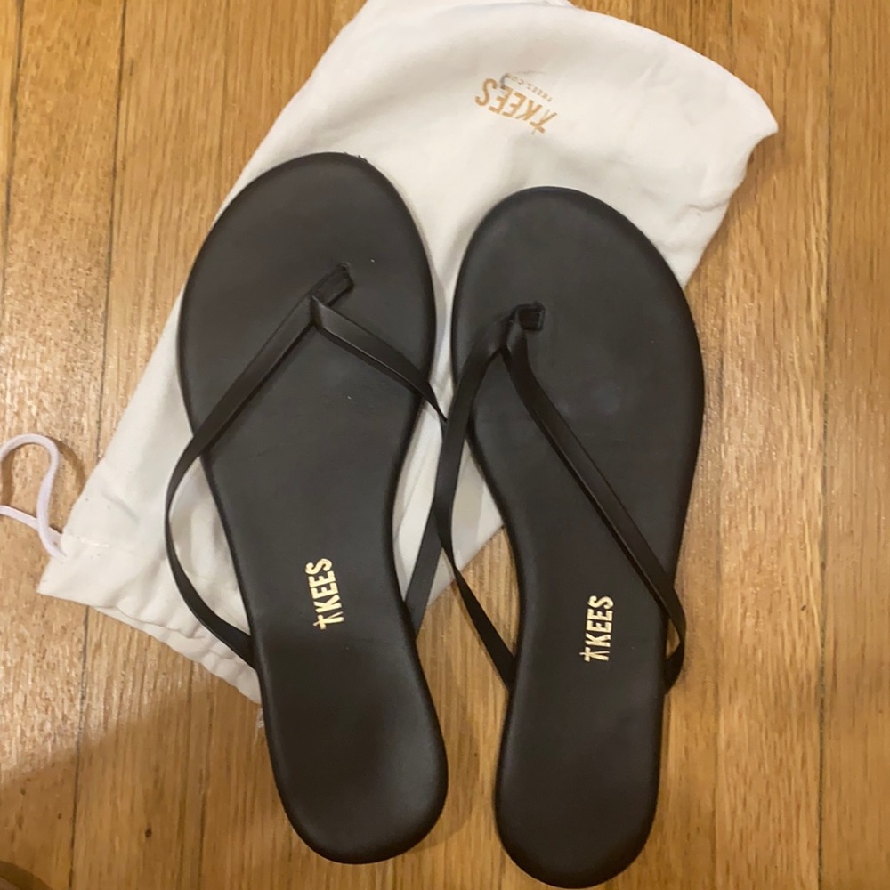 Worn once! Tkees leather flip flops